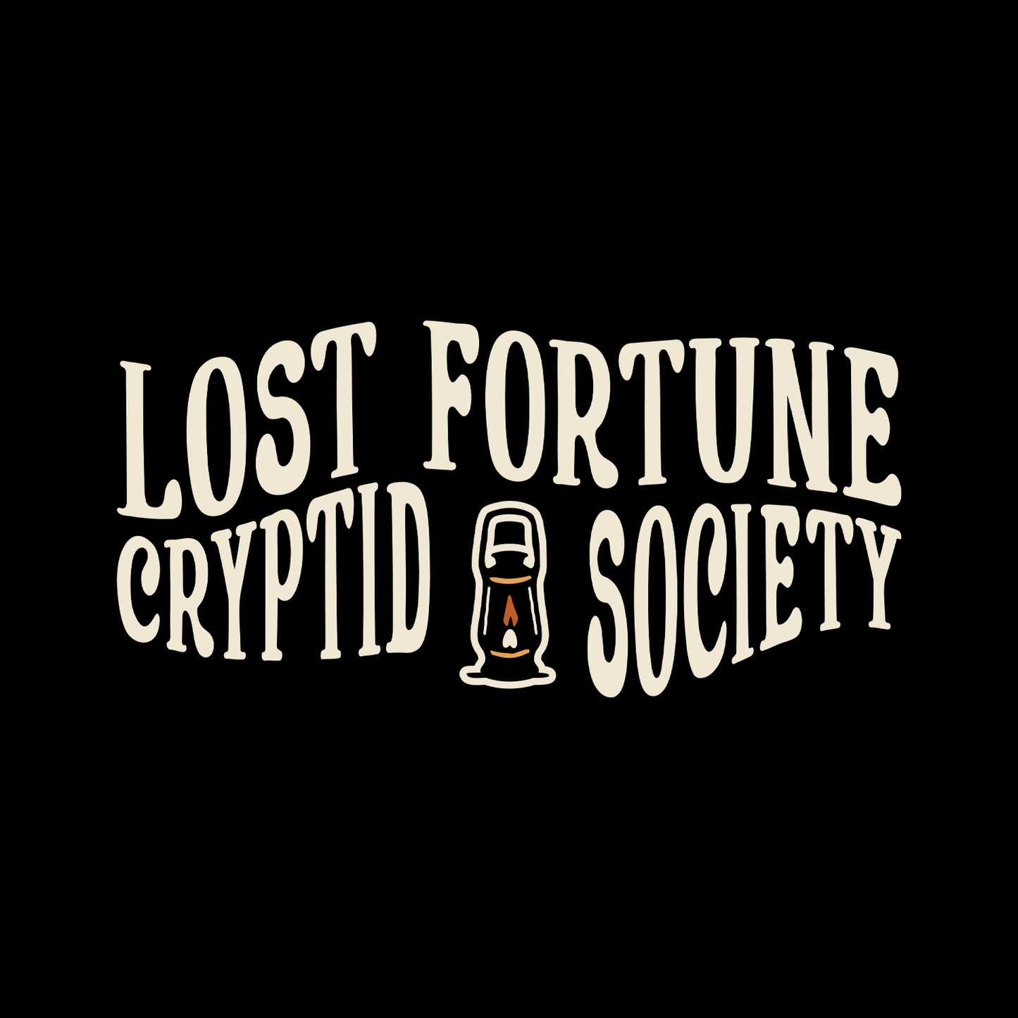 Black t-shirt that says "Lost Fortune Cryptid Society" on the front left breast. There is a lantern icon between "cryptid" and "society."