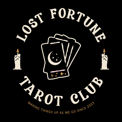 Artwork of candles and a stack of tarot cards with a moon and stars on the front. The text reads "Lost Fortune Tarot Club. Making things up as we go since 2023." 