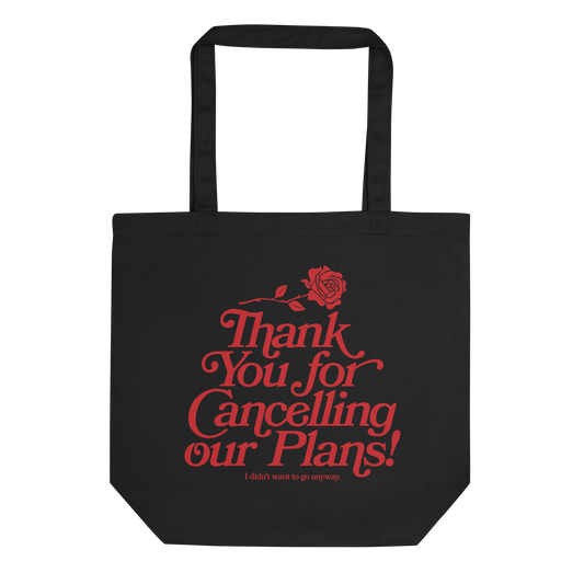 Black tote bag with artwork of a rose and the words "thank you for cancelling our plans! I didn't want to go anyway"