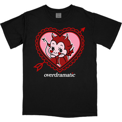 Devil cherub resting their head on their hands inside of a lacy heart with an arrow through it. Bottom text says "overdramatic."