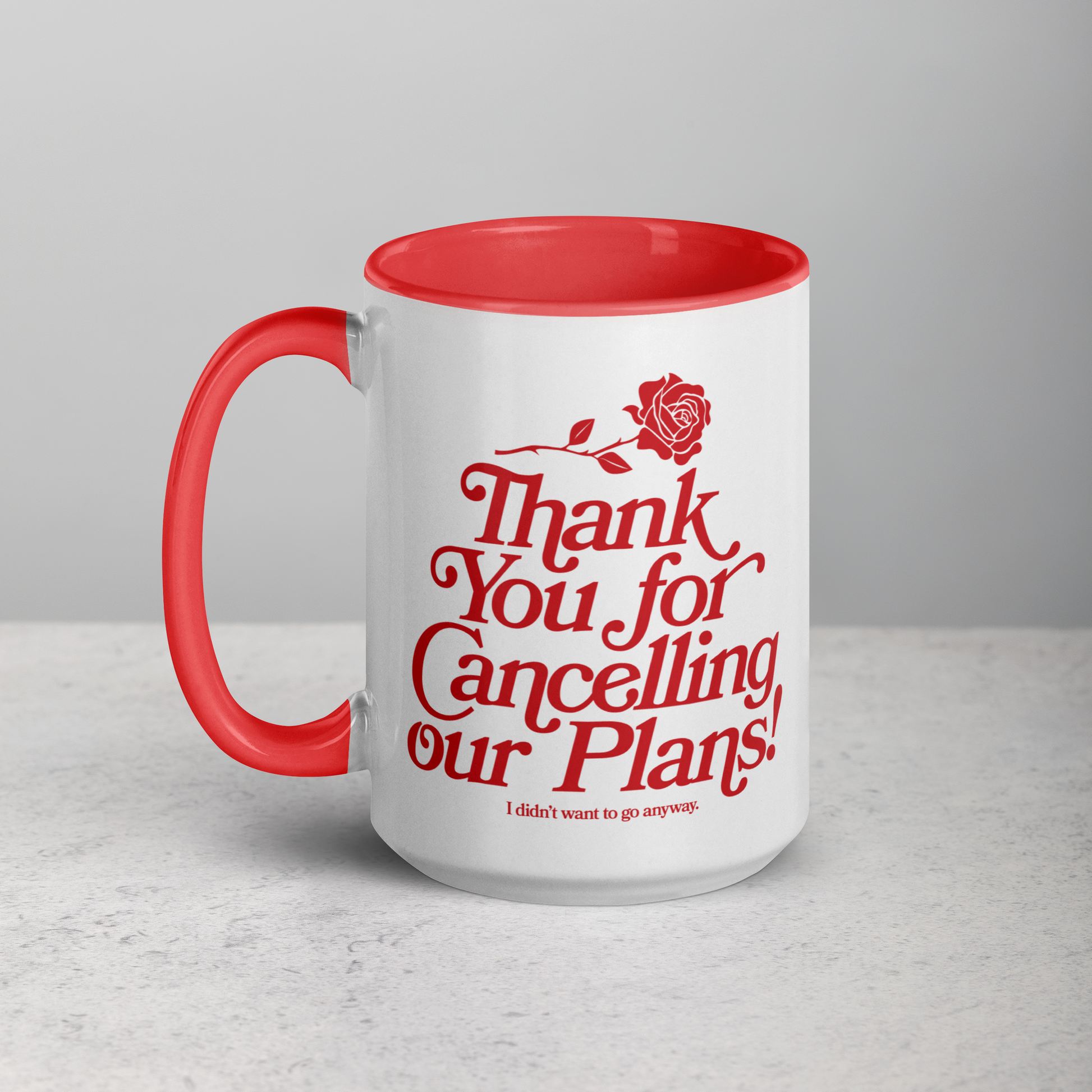 White ceramic mug with red handle and interior that says "thank you for cancelling our plans! I didn't want to go anyway" on the front